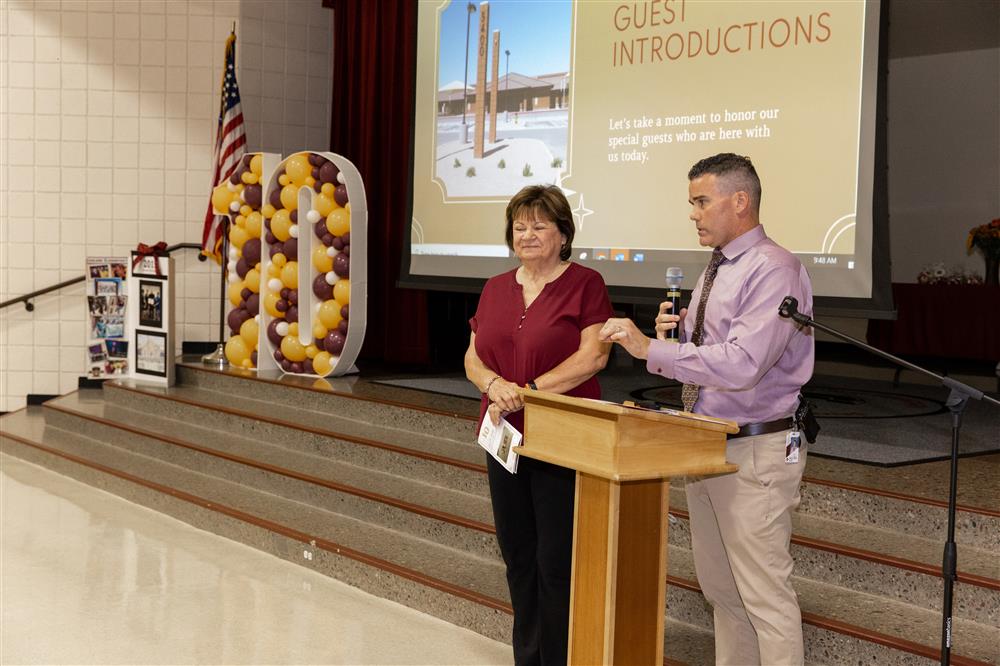 Carlson Elementary Principal Andy Morgan presents Carol Carlson, one of the school's namesakes.